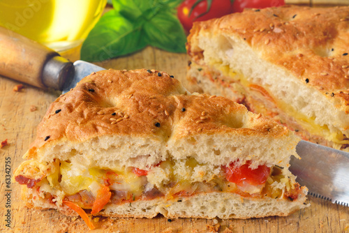 Photo: Bread filled with ham, cheese and tomato. Bread filled with ham, cheese and tomato.