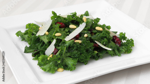 Photo: Kale salad served on a square plate. Kale salad served on a square plate.