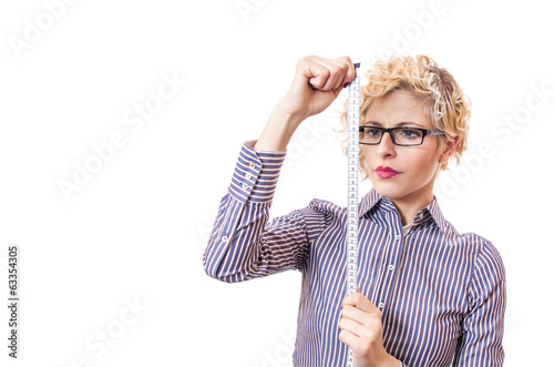 Photo: Young businesswoman with measurnig tape Young businesswoman with measurnig tape