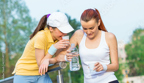 Photo: Friendship of two young girlfriends in healthy lifestyle Friendship of two young girlfriends in healthy lifestyle
