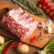 Slice of raw beef with fresh rosemary Slice of raw beef with fresh rosemary