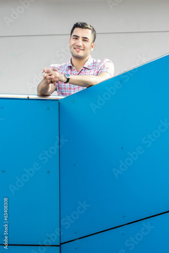 Photo: Smile man on balcony - terrace Smile man on balcony - terrace