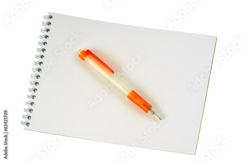 Photo: Le stylo sur le bloc-notes Le stylo sur le bloc-notes