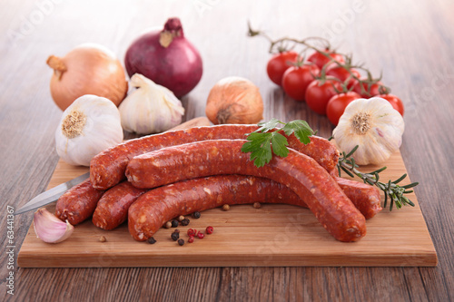 Photo: raw sausage on board raw sausage on board