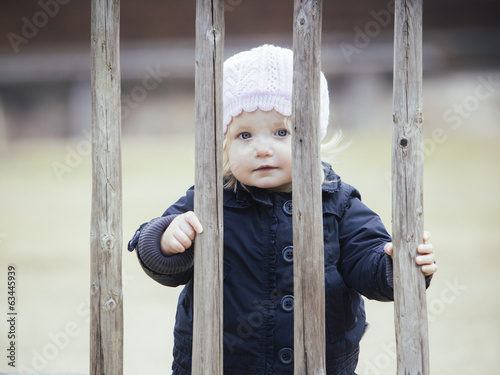 Photo: Little girl in Spring outdoors Little girl in Spring outdoors