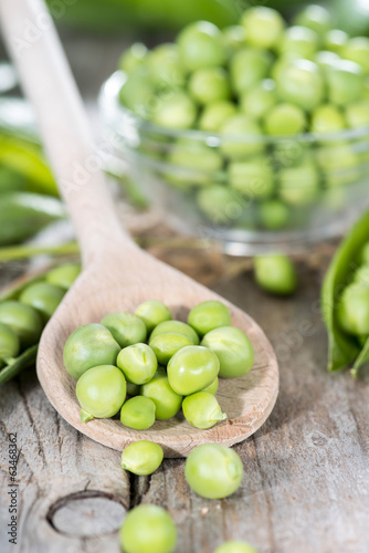 Photo: Fresh Peas on a cooking spoon Fresh Peas on a cooking spoon