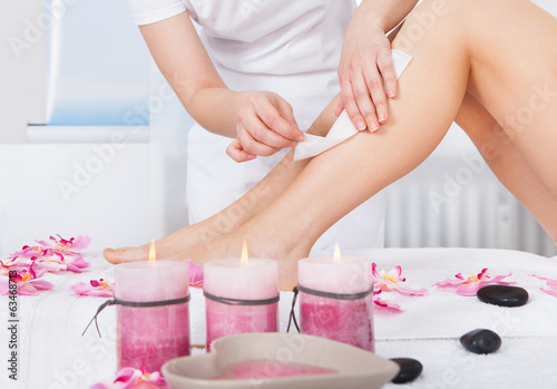 Photo: Woman Getting Thigh Massage Woman Getting Thigh Massage