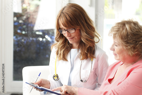 Photo: Female doctor with senior patient Female doctor with senior patient