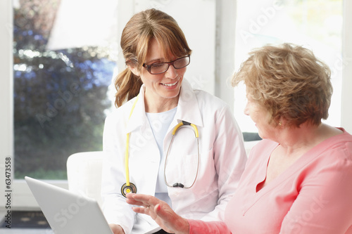 Photo: Female doctor with senior patient Female doctor with senior patient