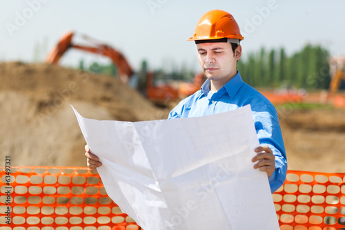 Photo: Engineer looking a blueprint Engineer looking a blueprint