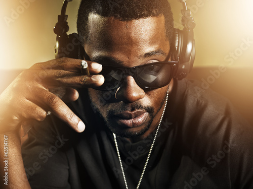 Photo: dj smoking and wearing sunglasses dj smoking and wearing sunglasses