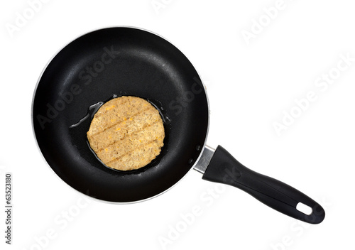 Photo: Top view vegetable burger patty in pan Top view vegetable burger patty in pan