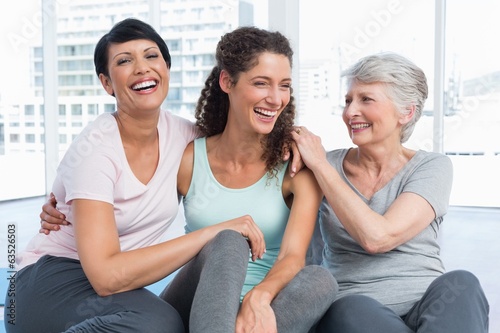 Photo: Cheerful fit women in yoga class Cheerful fit women in yoga class