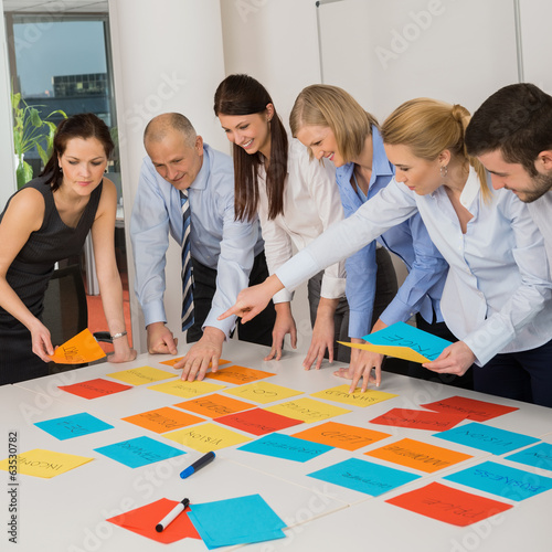 Photo: Business Team Brainstorming Using Color Labels Business Team Brainstorming Using Color Labels