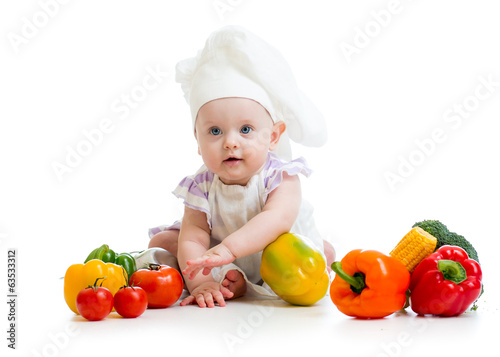 Photo: baby chef with healthy food vegetables baby chef with healthy food vegetables