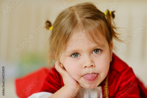 Photo: toddler girl showing tongue out toddler girl showing tongue out