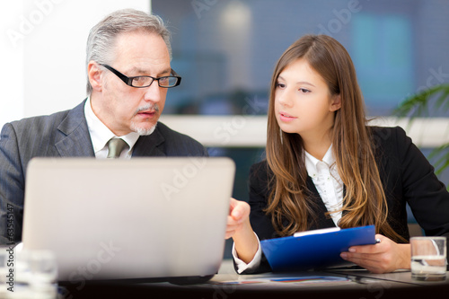 Photo: Couple of businesspeople discussing Couple of businesspeople discussing