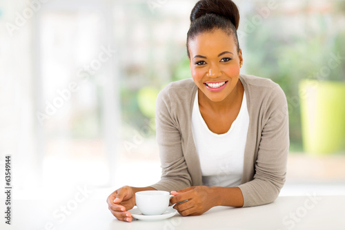 Photo: afro american woman drinking coffee afro american woman drinking coffee