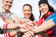 teenagers hands on top of each other outdoors teenagers hands on top of each other outdoors