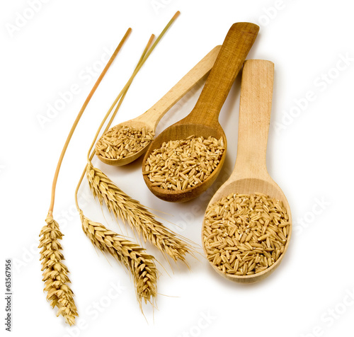Photo: Isolated image of a spoon and wheat on white background Isolated image of a spoon and wheat on white background
