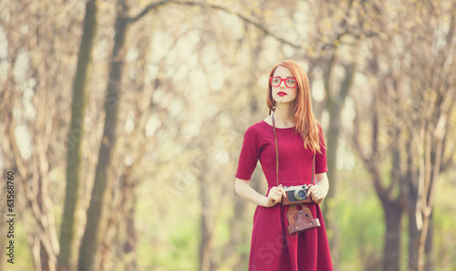 Photo: Redhead women in a park Redhead women in a park
