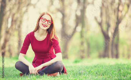 Photo: Redhead women in a park Redhead women in a park
