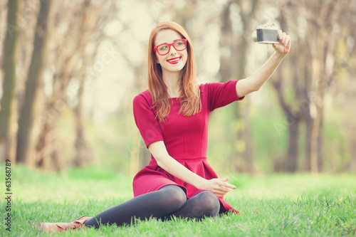 Photo: Redhead women in a park Redhead women in a park