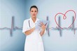 Composite image of pretty nurse using tablet pc Composite image of pretty nurse using tablet pc