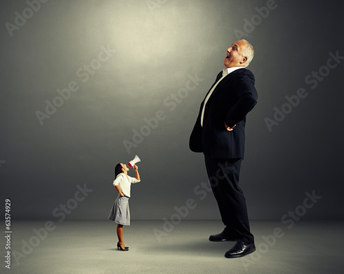 Photo: displeased woman and laughing man displeased woman and laughing man
