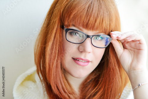 Photo: caucasian redhead girl with glasses caucasian redhead girl with glasses