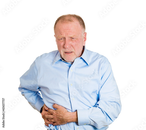 Photo: Senior, old man having right-sided abdominal pain Senior, old man having right-sided abdominal pain