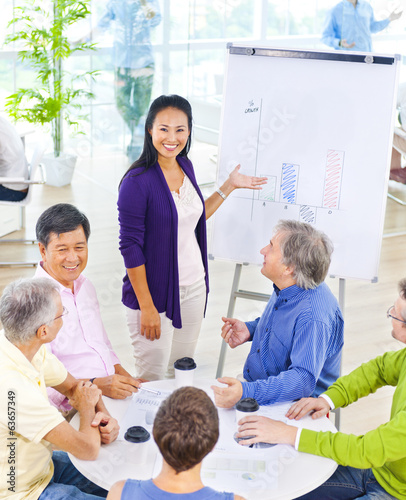 Photo: Group of Business People in the Office Group of Business People in the Office
