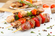 Pork kebab on wooden table close up Pork kebab on wooden table close up
