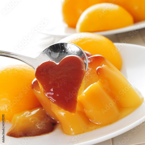 Photo: creme caramel and peach in syrup creme caramel and peach in syrup