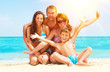 Happy Family Having Fun at the Beach. Summer Holidays Happy Family Having Fun at the Beach. Summer Holidays