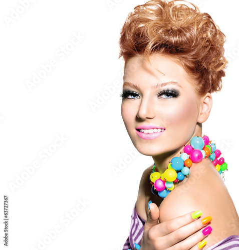 Fototapeta Beauty girl with colorful makeup, nail polish and accessories