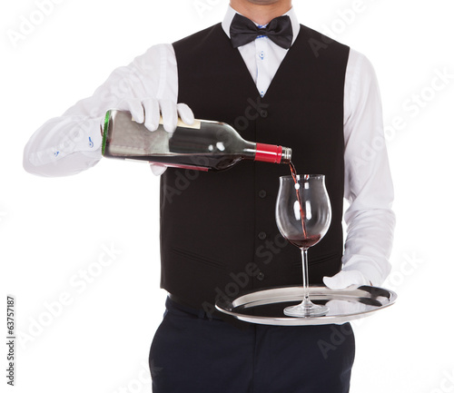 Photo: Waiter Serving Red Wine In Glass Waiter Serving Red Wine In Glass