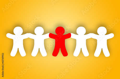 Photo: Paper team white people over orange background Paper team white people over orange background