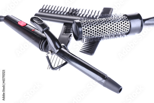 Photo: Professional hairdresser tools isolated on white Professional hairdresser tools isolated on white