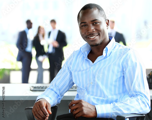 Photo: Portrait of smiling African American business man Portrait of smiling African American business man