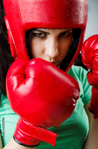 Photo: Woman boxer on white background Woman boxer on white background