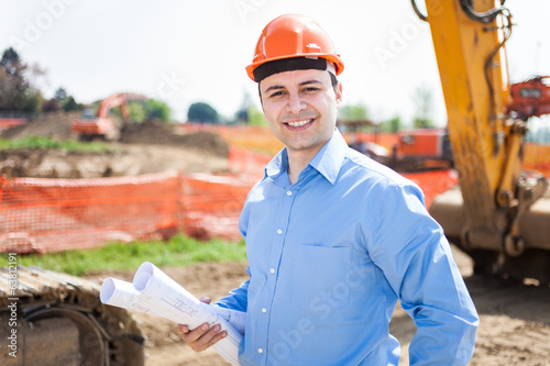 Photo: Man at work in a construction site Man at work in a construction site