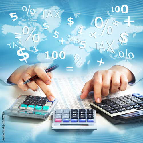 Photo: Hands of business people with calculator. Hands of business people with calculator.