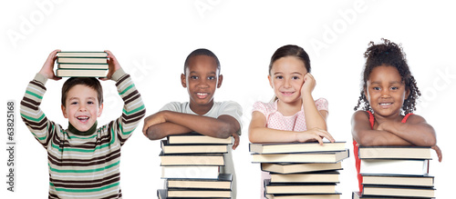 Photo: Four funny children with many books Four funny children with many books