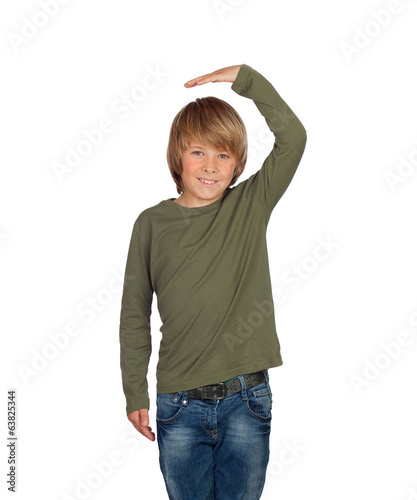 Photo: Preteen boy pointing out what has grown Preteen boy pointing out what has grown