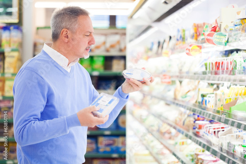 Photo: Man shopping at the supermarket Man shopping at the supermarket