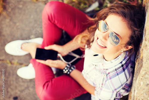Photo: girl with headphones listening to music girl with headphones listening to music