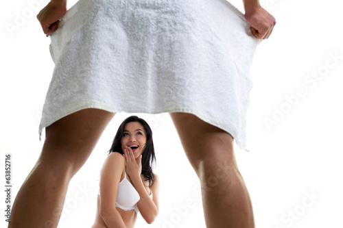 Photo: Playful man flirting with young beautiful woman Playful man flirting with young beautiful woman