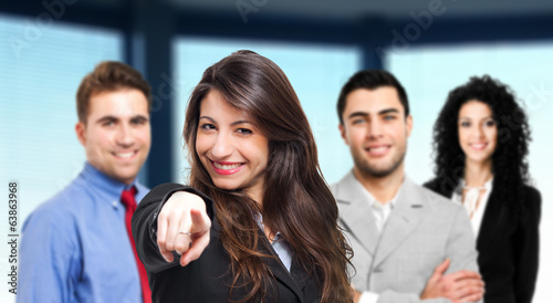 Photo: Businesswoman pointing at you in front of her team Businesswoman pointing at you in front of her team