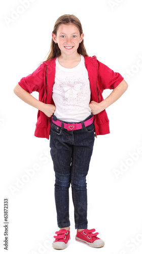 Photo: beautiful little girl in sport clothes isolated on white beautiful little girl in sport clothes isolated on white